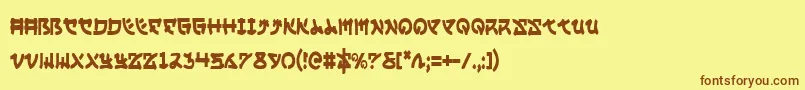 フォントYamamotoc – 茶色の文字が黄色の背景にあります。