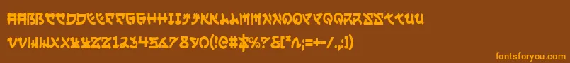 フォントYamamotoc – オレンジ色の文字が茶色の背景にあります。