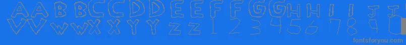 LoveDrug-fontti – harmaat kirjasimet sinisellä taustalla