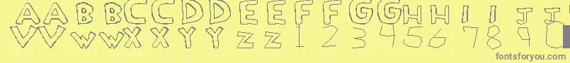 LoveDrug-fontti – harmaat kirjasimet keltaisella taustalla