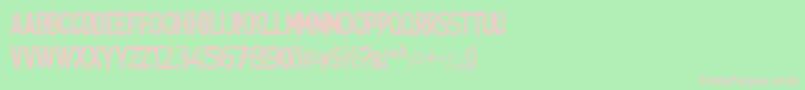 Spanishstencil-fontti – vaaleanpunaiset fontit vihreällä taustalla
