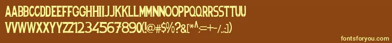 Spanishstencil-fontti – keltaiset fontit ruskealla taustalla