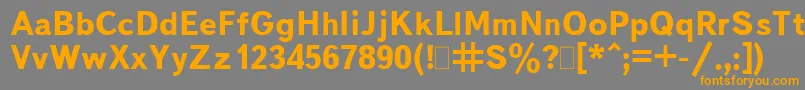 フォントBukvarnayaBold – オレンジの文字は灰色の背景にあります。