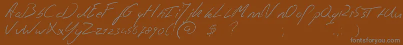 Jaspershandwriting-fontti – harmaat kirjasimet ruskealla taustalla