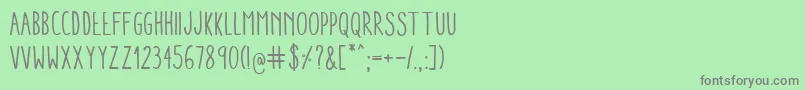 AracneCondensedRegular-fontti – harmaat kirjasimet vihreällä taustalla