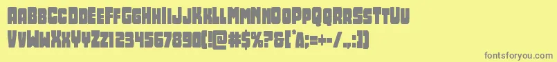 Opusmundicond-fontti – harmaat kirjasimet keltaisella taustalla