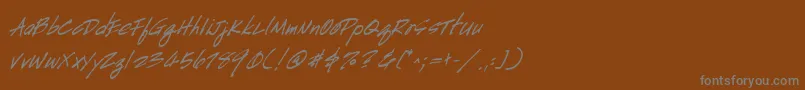 Fonte HandscriptBoldItalic – fontes cinzas em um fundo marrom