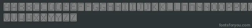 Fonte Domino – fontes cinzas em um fundo preto
