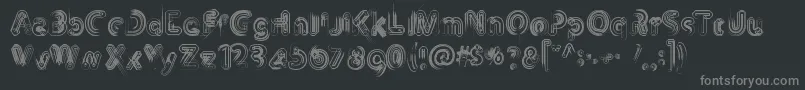 Th3Machine-fontti – harmaat kirjasimet mustalla taustalla