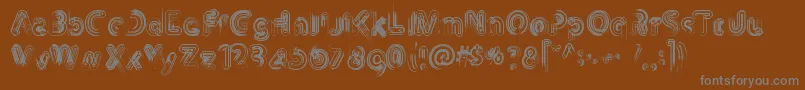 フォントTh3Machine – 茶色の背景に灰色の文字