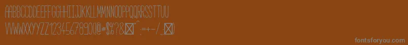 Czcionka CabanaRegular – szare czcionki na brązowym tle