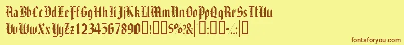 フォントAlaricssk – 茶色の文字が黄色の背景にあります。