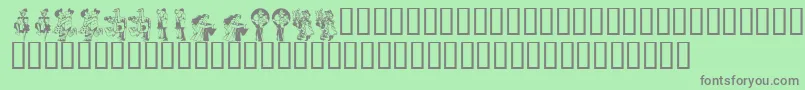 KrKickUpYourHeels-Schriftart – Graue Schriften auf grünem Hintergrund