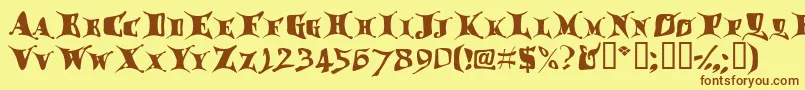 フォントDragglet – 茶色の文字が黄色の背景にあります。