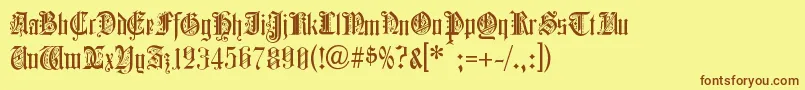 フォントColcbl – 茶色の文字が黄色の背景にあります。