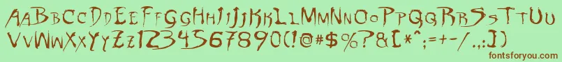 DinobotsNormal Font – Brown Fonts on Green Background