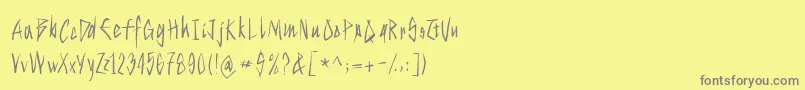 フォントStrokeyhand – 黄色の背景に灰色の文字