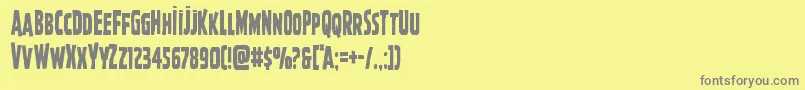 フォントGhoulishintentcond – 黄色の背景に灰色の文字