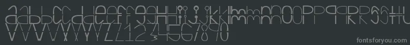 Cortada-Schriftart – Graue Schriften auf schwarzem Hintergrund