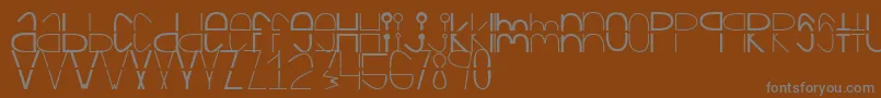 フォントCortada – 茶色の背景に灰色の文字