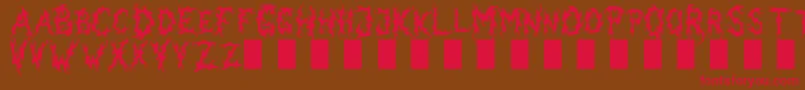 フォントDarkGarden – 赤い文字が茶色の背景にあります。