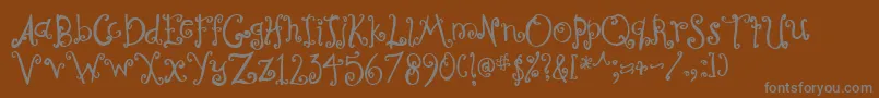 フォントCurly – 茶色の背景に灰色の文字