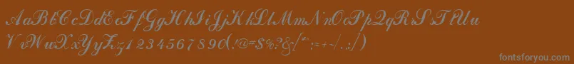 DahlingscriptsskRegular-fontti – harmaat kirjasimet ruskealla taustalla