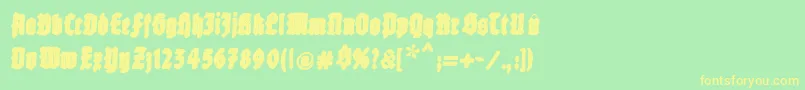 フォントFatfreefrax – 黄色の文字が緑の背景にあります