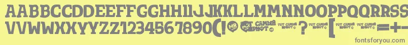 フォントTotShriftBold – 黄色の背景に灰色の文字