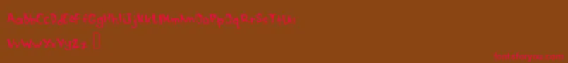 DrippymcdripNm Font – Red Fonts on Brown Background