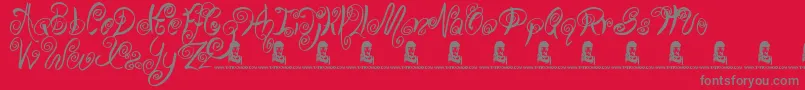 SwirlyShirley-Schriftart – Graue Schriften auf rotem Hintergrund