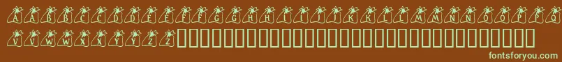 フォントKrSantasBag – 緑色の文字が茶色の背景にあります。