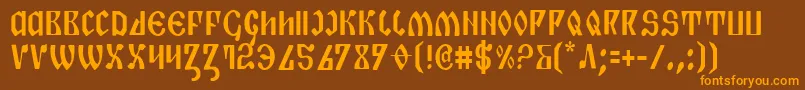 フォントPiperc – オレンジ色の文字が茶色の背景にあります。