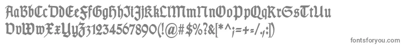 TypographergotischSchmalBold-fontti – harmaat kirjasimet valkoisella taustalla