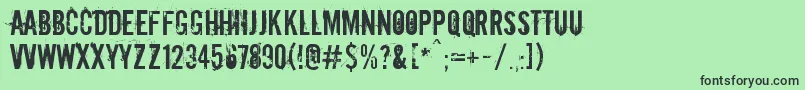 フォントDowncome – 緑の背景に黒い文字