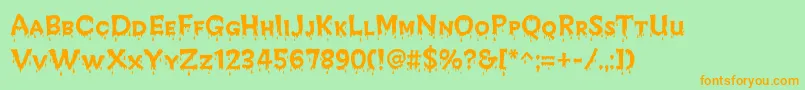 CreepyRegular-Schriftart – Orangefarbene Schriften auf grünem Hintergrund