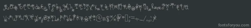 フォントBowbowblacksheep – 黒い背景に灰色の文字