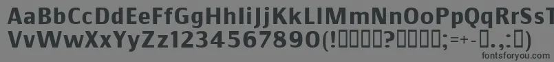 フォントCommsb – 黒い文字の灰色の背景
