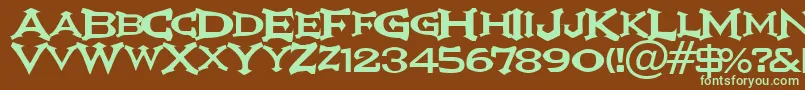 フォントIkarv – 緑色の文字が茶色の背景にあります。