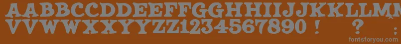 JmhSaloon Font – Gray Fonts on Brown Background