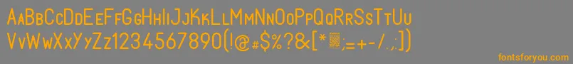 フォントFabiolosmallcapRegular – オレンジの文字は灰色の背景にあります。