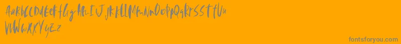 Perfecta-Schriftart – Graue Schriften auf orangefarbenem Hintergrund