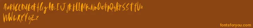 Perfecta-Schriftart – Orangefarbene Schriften auf braunem Hintergrund
