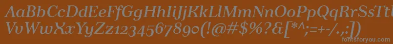 TusartextosfItalic-fontti – harmaat kirjasimet ruskealla taustalla