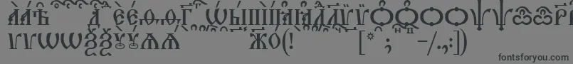 TriodionCapsKucs-Schriftart – Schwarze Schriften auf grauem Hintergrund