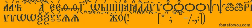 Czcionka TriodionCapsKucs – czarne czcionki na pomarańczowym tle