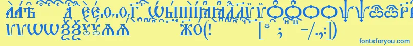 TriodionCapsKucs Font – Blue Fonts on Yellow Background