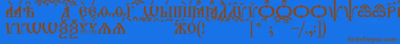 フォントTriodionCapsKucs – 茶色の文字が青い背景にあります。