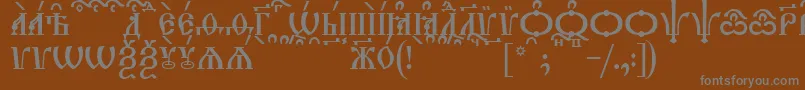 フォントTriodionCapsKucs – 茶色の背景に灰色の文字