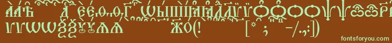 フォントTriodionCapsKucs – 緑色の文字が茶色の背景にあります。